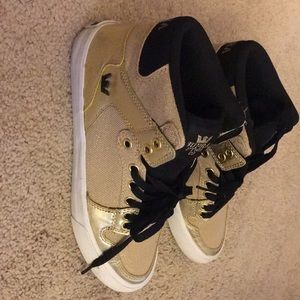 Gold womans supra vaider gold and black size 8